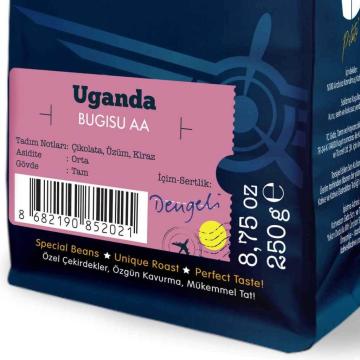 Moliendo Uganda Bugia to the local coffee