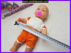 Şimşek Toys Ağlayan Emzikli  Bebek 33 cm x 15cm Ağlayan Emziği çıkarınca ağlama sesi gelir ( turuncu şapkası yoktur )