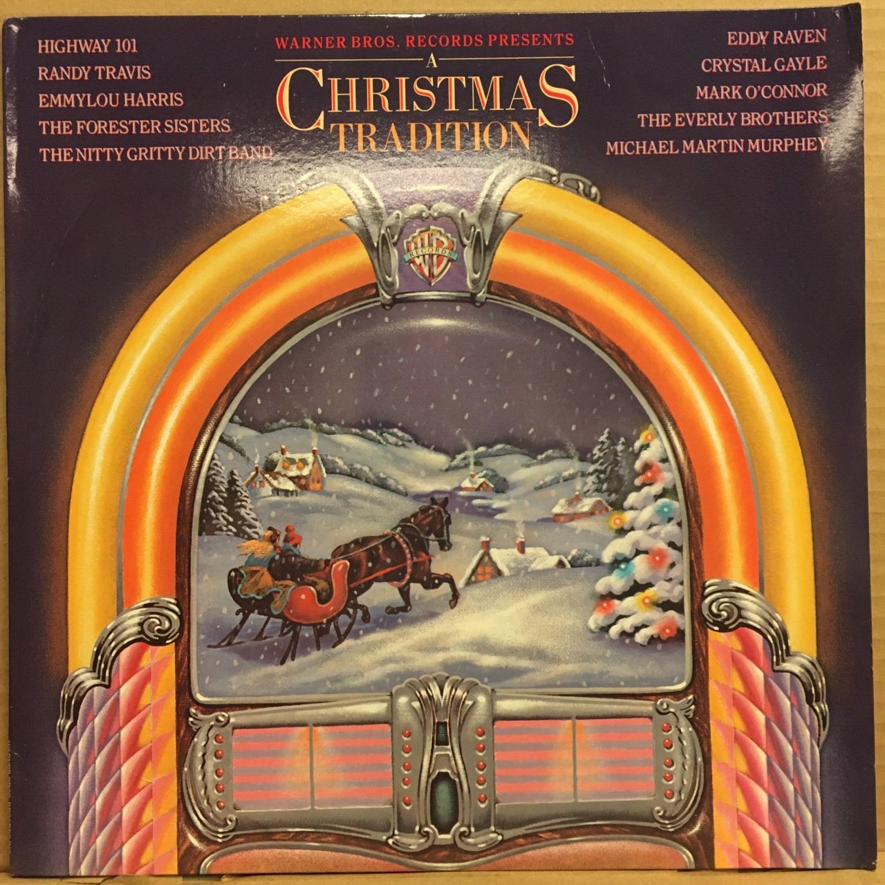 A CHRISTMAS TRADITION RANDY TRAVIS, EMMYLOU HARRIS, CRYSTAL GAYLE.. (1987) 2.EL PLAK
