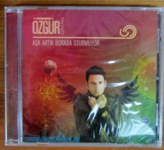 ÖZGÜR - AŞK ARTIK BURADA OTURMUYOR CD SIFIR