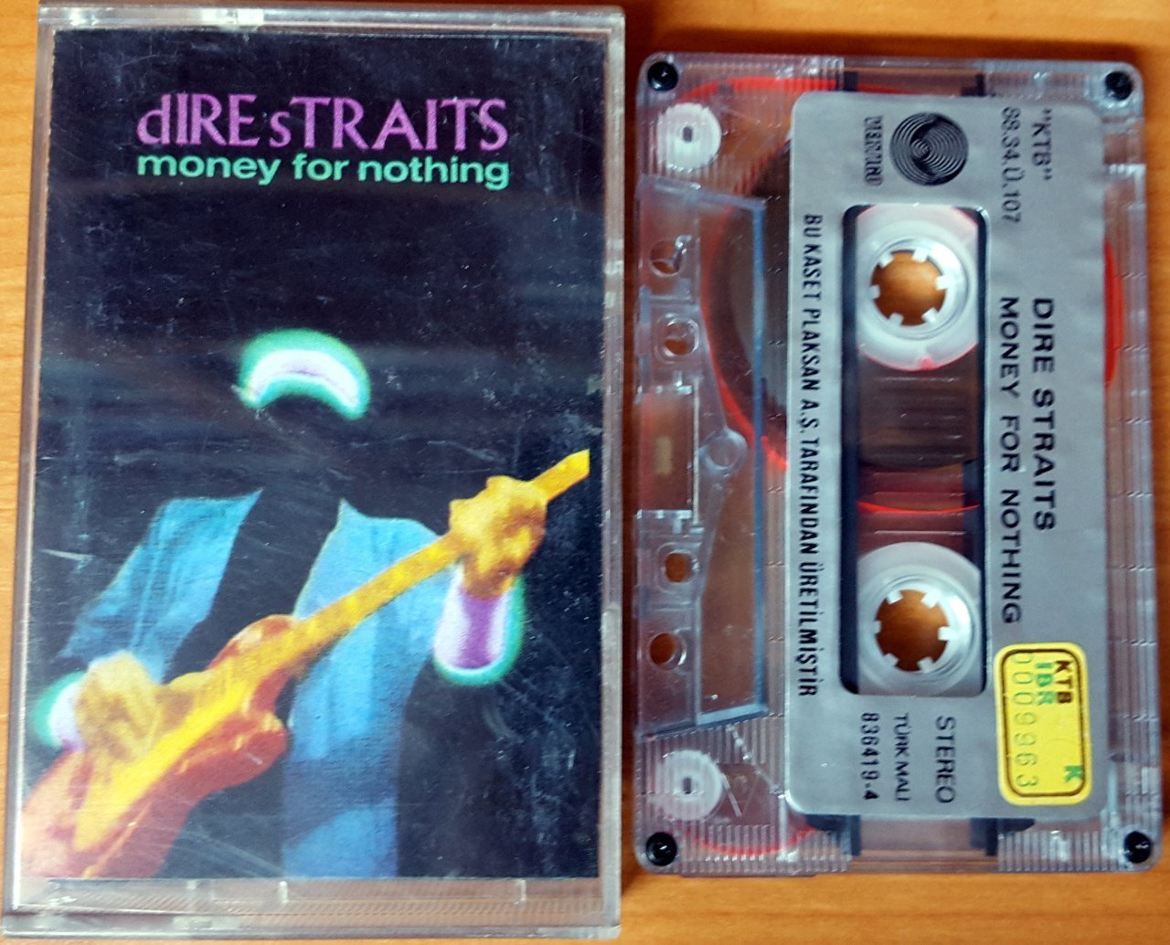 DIRE STRAITS - MONEY FOR NOTHING (1988) PLAKSAN TRANSPARENT CASSETTE MADE IN TURKEY ''USED''