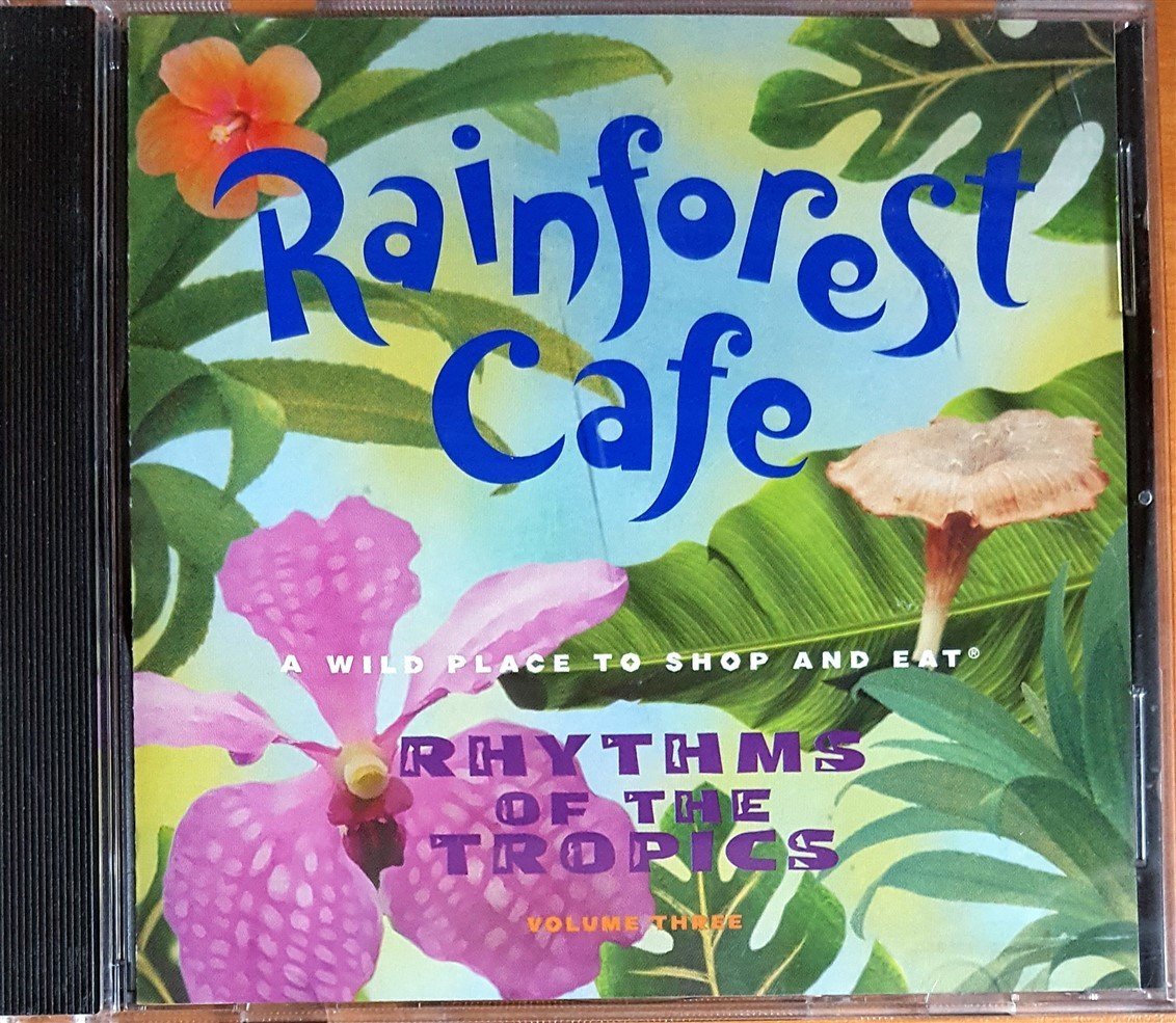RAINFOREST CAFE / RHYTHMS OF THE TOPICS VOLUME THREE / GERA SAMBA, AIRTO, KHALED, LIBRE, DANIEL PONCE (1998) POLYGRAM / AEI MUSIC CD 2.EL