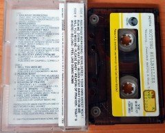 NOTTING HILLBILLIES - MISSING...PRESUMED HAVING A GOOD TIME (1990) PLAKSAN CASSETTE MADE IN TURKEY ''USED'' PAPER LABEL (PRODUCED BY MARK KNOPFLER)