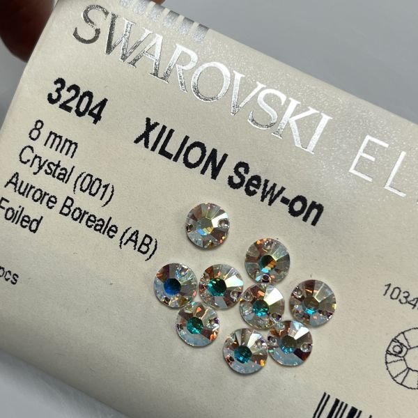 3204 8mm Crystal Aurora Boreale (001AB) F - Janjan Yuvarlak İki Delikli Dikme Taş