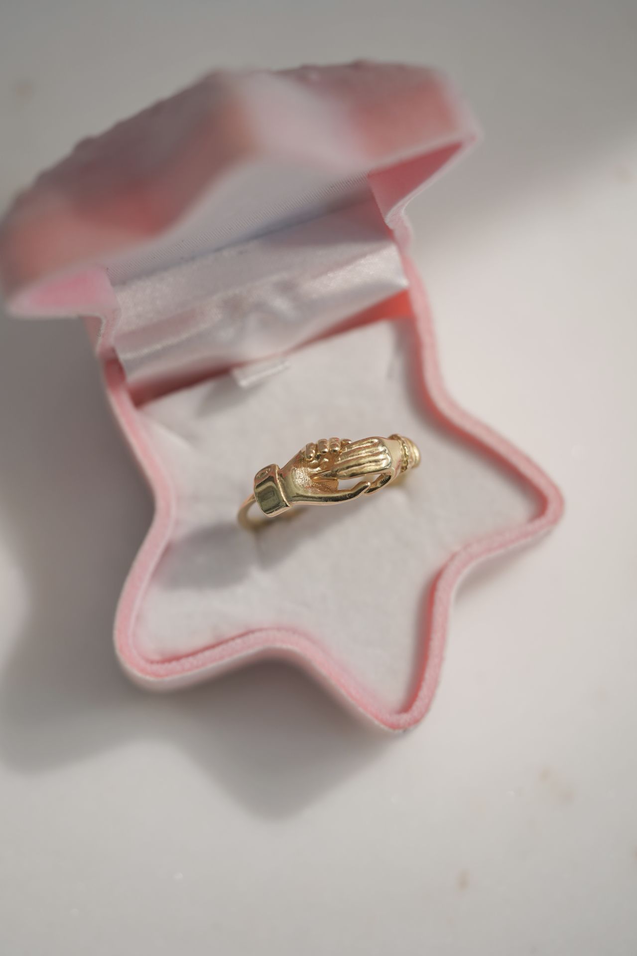Clasped hands ring best sale