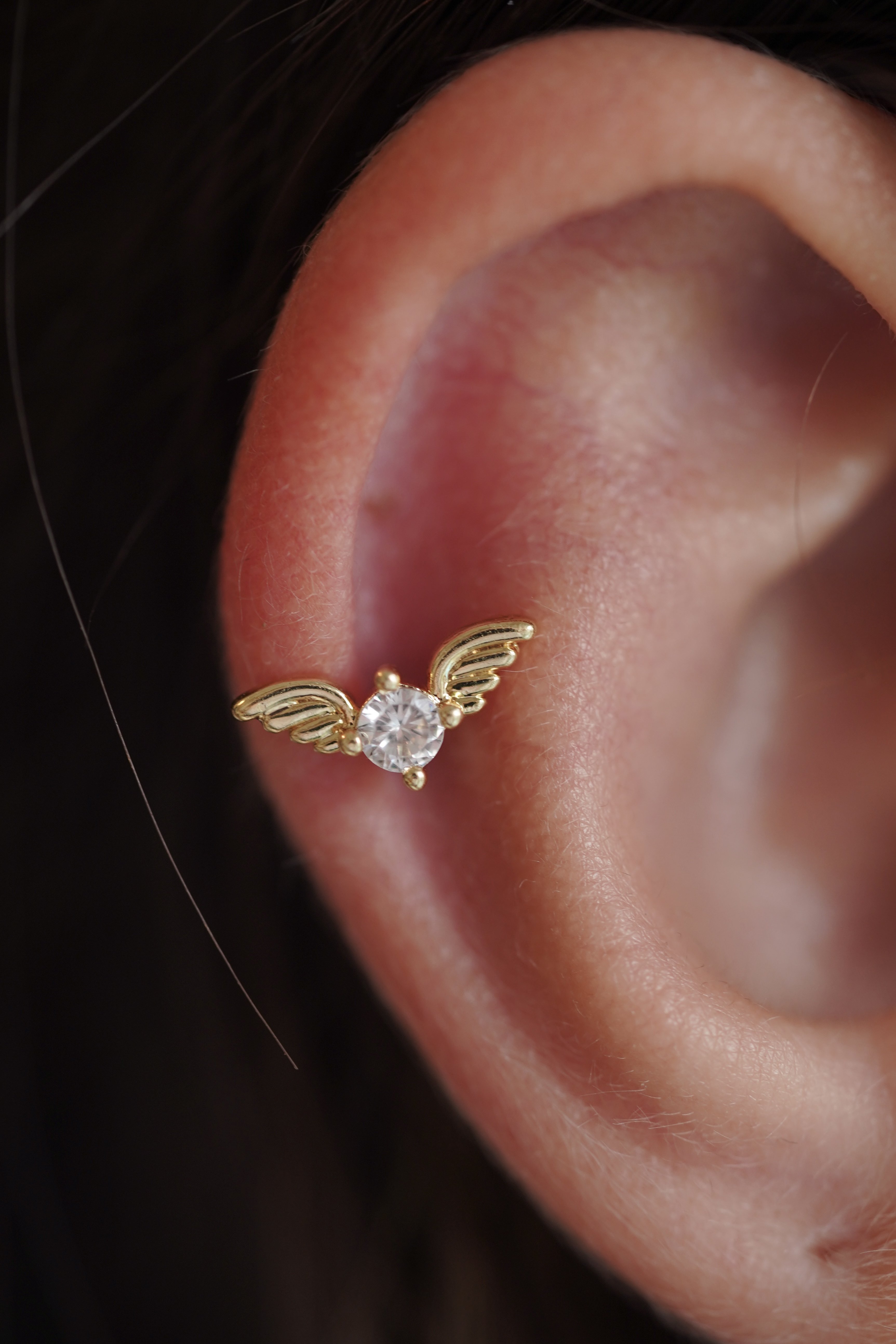 Angel body shop piercing