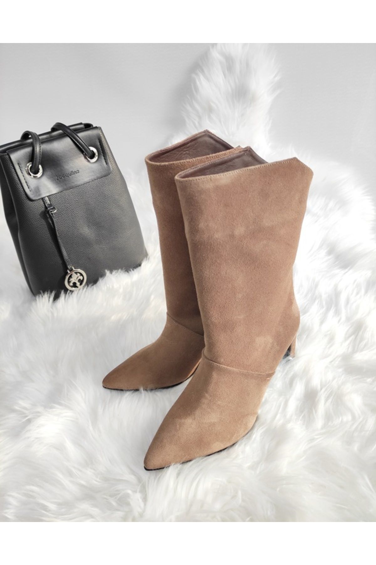 KADIN HAKİKİ DERİ ARA BOY ÇİZME