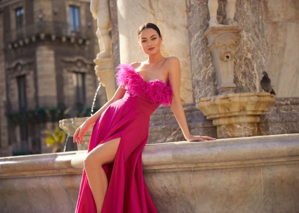 Evening dress model designed as strapless, straight neckline, otris on the collar, deep slit, Hellenic style satin silk fabric.