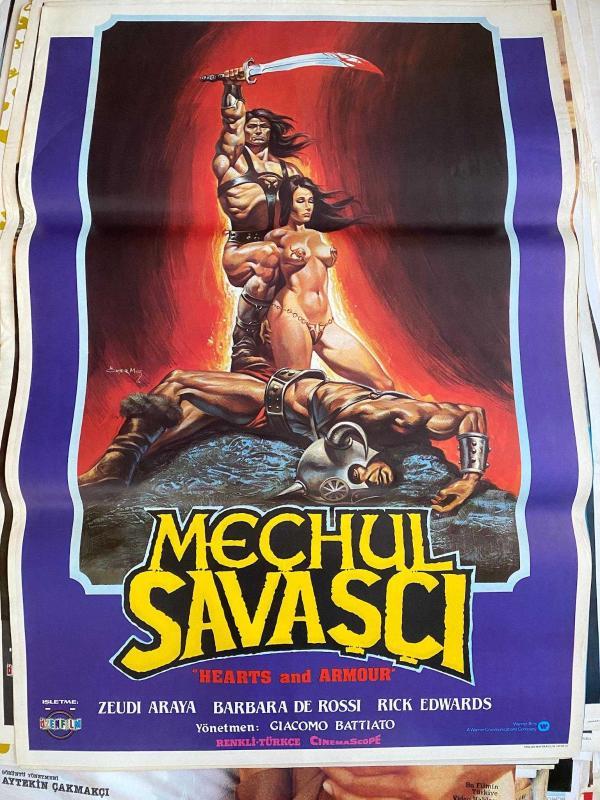 MEÇHUL SAVAŞÇI FİLMİNİN AFİŞİ OYNAYANLAR: ZEUDI ARAYA, BARBARA DE ROSSI, RICK EDWARDS YÖNETMEN: GIACOMO BATTIATO - ÖMER MUZ