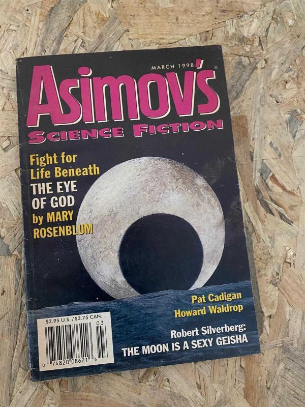 Asimov's Science Fiction March 1998 | Fight for Life Beneath THE EYE OF GOD by Mary Rosenblum