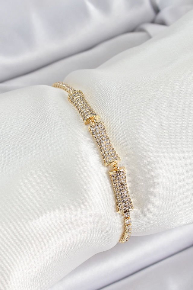 Pirinç Gold Renk Zirkon Taşlı Kemik Model Kadın Bileklik
