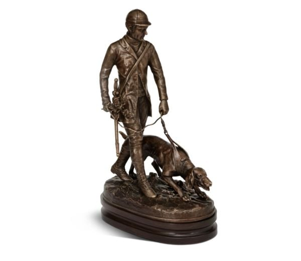 A MAN GUIDING A DOG
