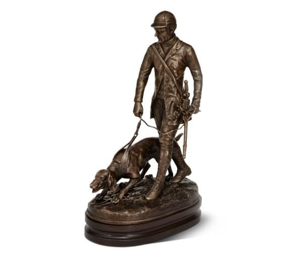 A MAN GUIDING A DOG