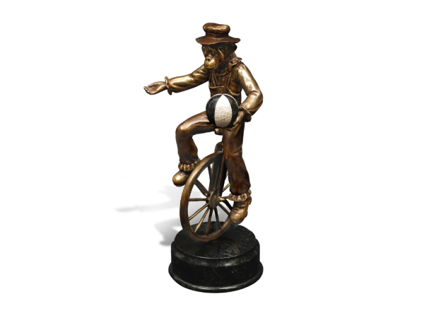 CHIMPANZEE RIDING A WHEEL
