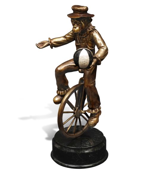 CHIMPANZEE RIDING A WHEEL