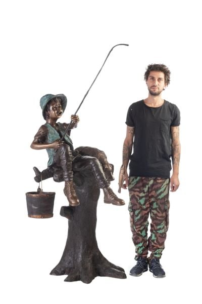 BOY HOLDING A FISH