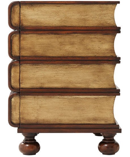 A HAND CARVED AND GİLT FAUX BOOK CHEST OF DRAWERS