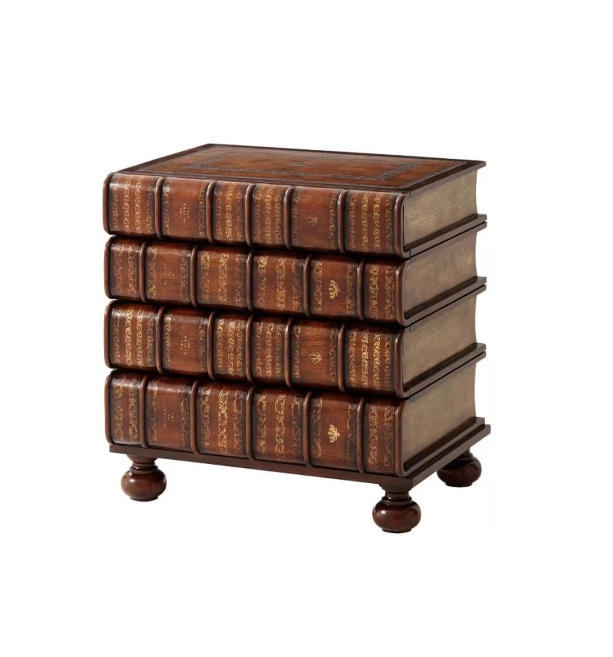 A HAND CARVED AND GILT FAUX BOOK CHEST
