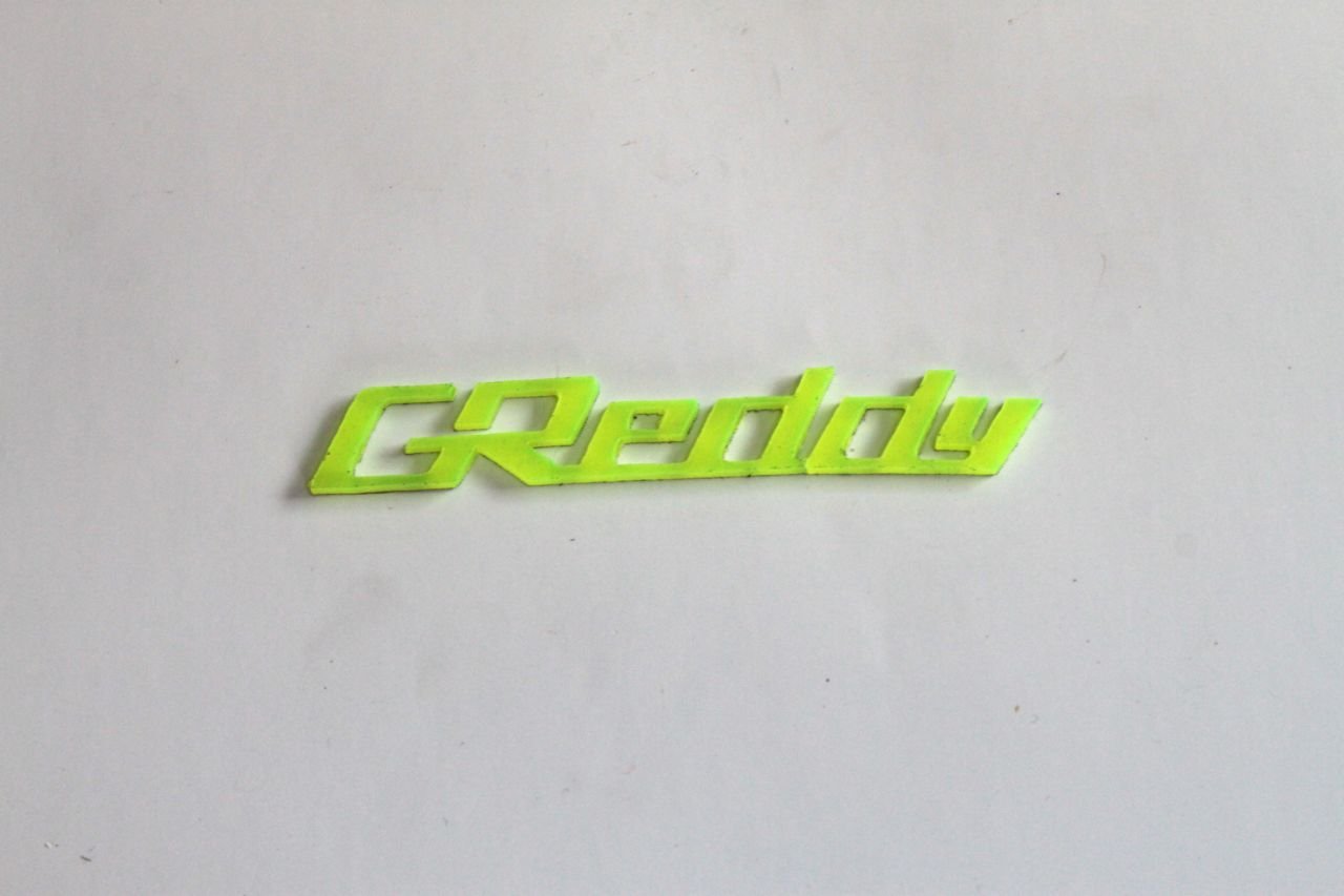 Greddy Pleksi Logo