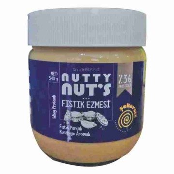 NUTTY NUT'S YER FISTIĞI EZMESİ FISTIK PARÇALI KURABİYE AROMALI WHEY PROTEİNLİ (%36) 340GR