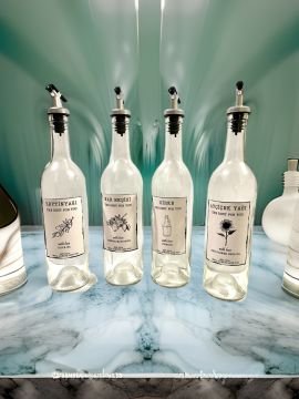750 ML Şeffaf Şişe Sızdırmaz Başlıklı 4 Adet Cam Şişe Yağdanlık Altlıksız Zeytinyağı-Ayçiçekyağı Sirke ve Nar Ekşisi Yazılı