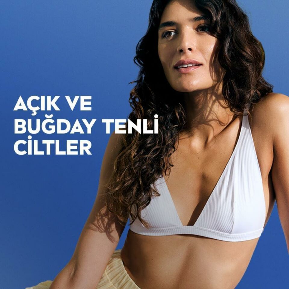 Nivea Q10 Sıkılaştırıcı Bronzlaştırıcı Vücut Losyonu 400ml, 7 Günde Sıkılaşma,Açık ve Buğday Ten,Normal Cilt